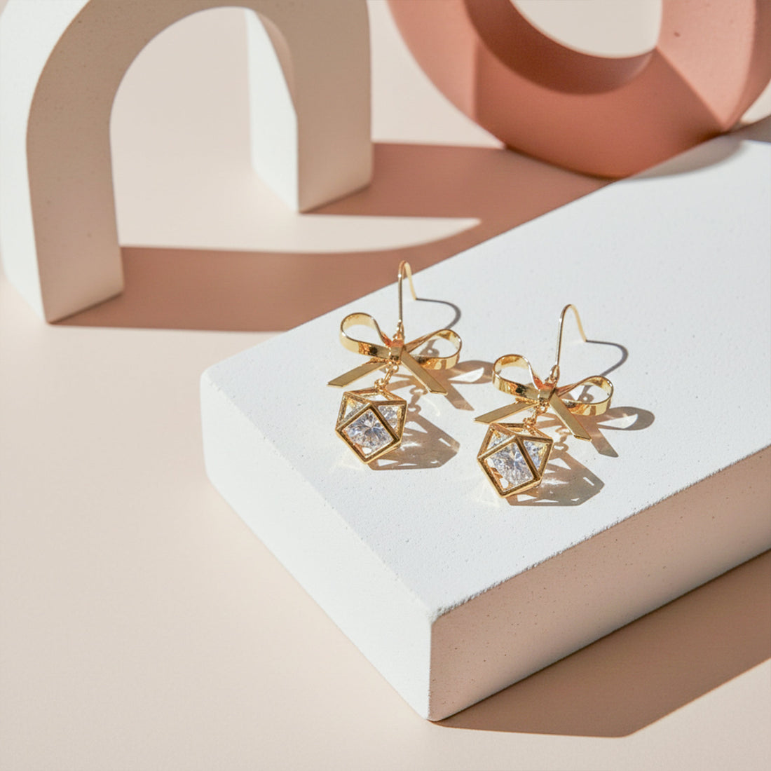Gold-Toned Bow Cube Dangle Ear Studs GWE -110