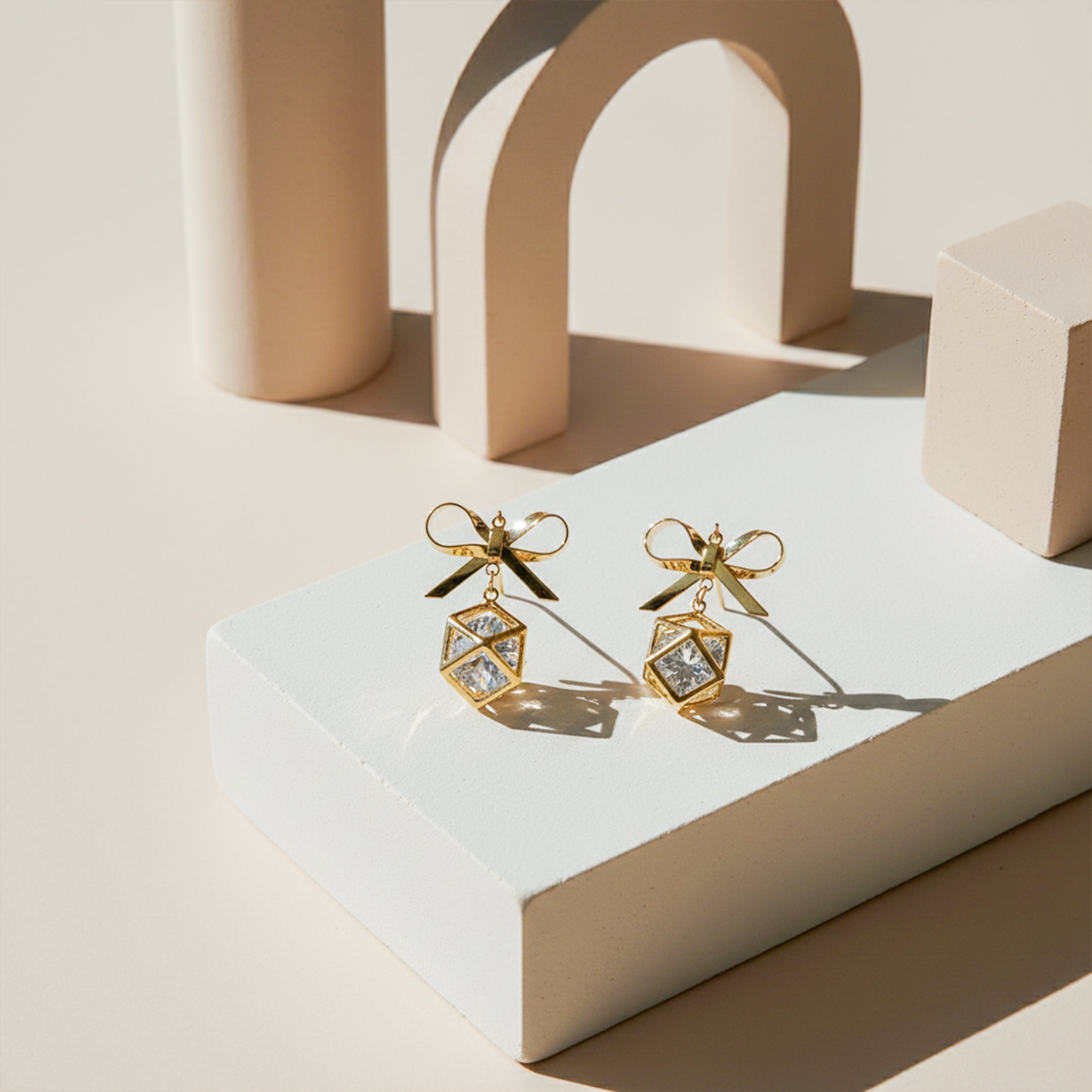 Gold-Toned Bow Cube Dangle Ear Studs GWE -110