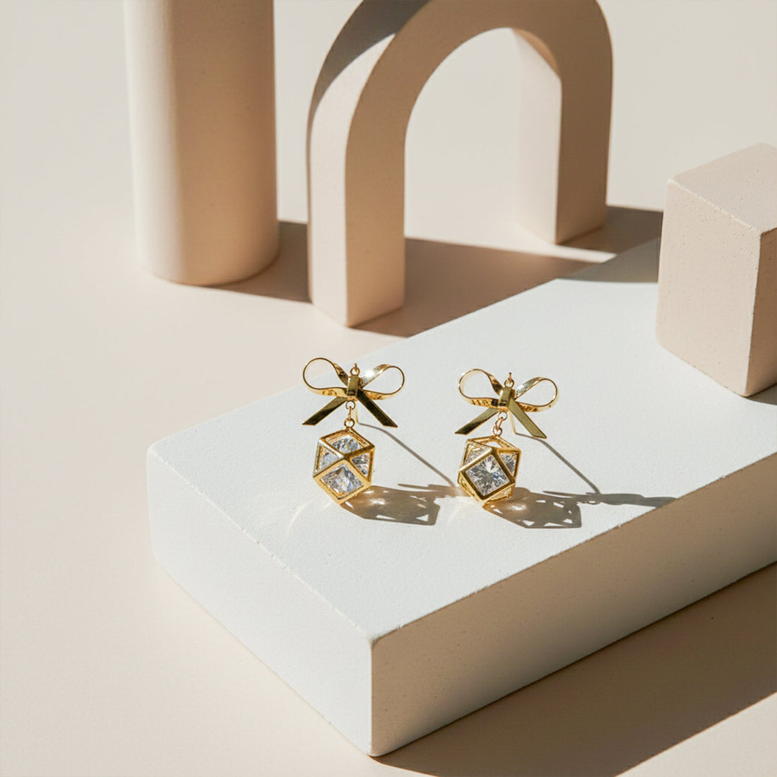 Gold-Toned Bow Cube Dangle Ear Studs GWE -110